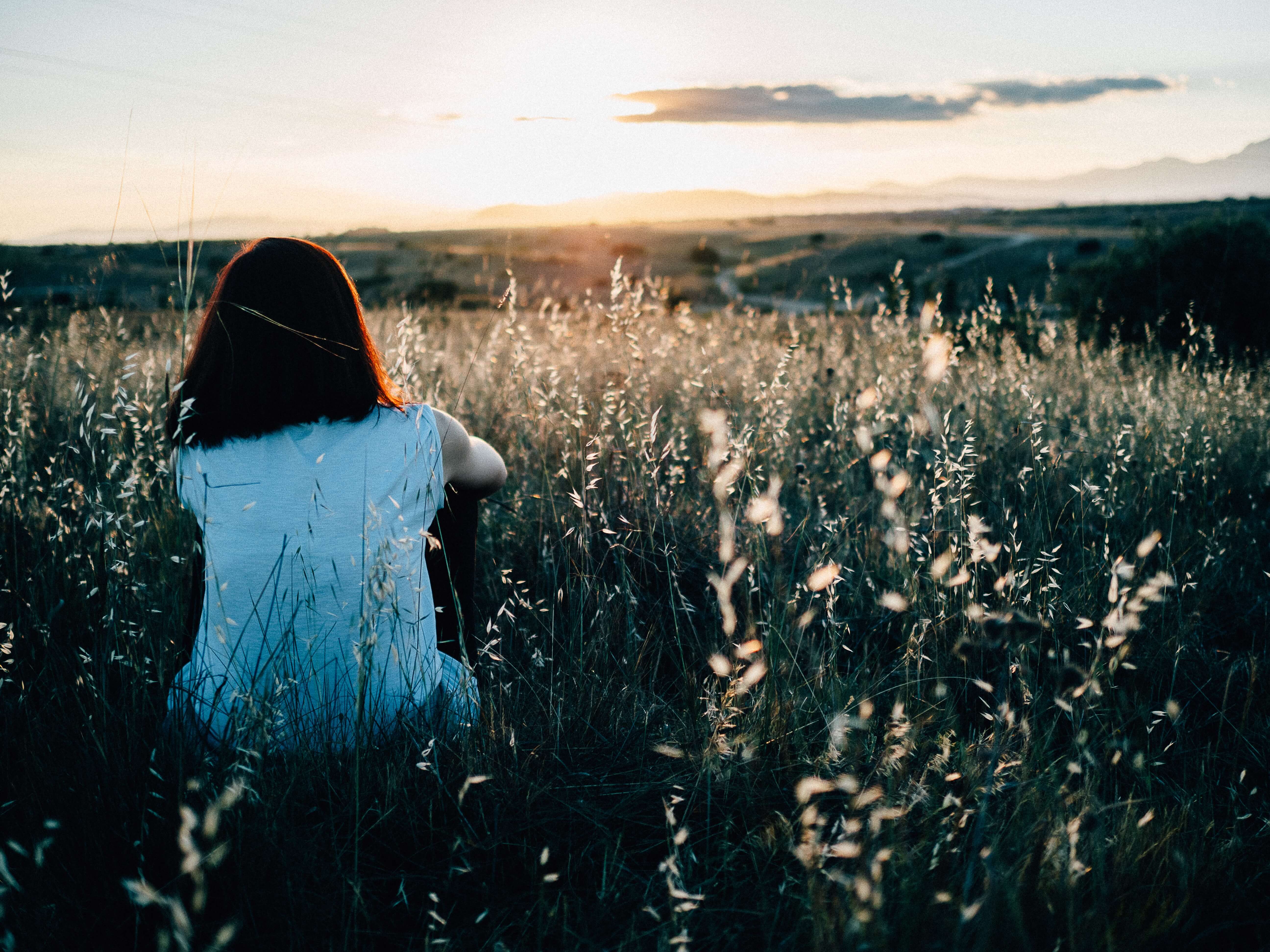 woman in grass field